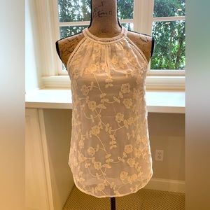 Sleeveless cream embroidered blouse